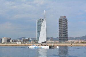 Barcelona Catamaran Party Tour For Young People - The swim stop: tethered rafts, float games, and real Mediterranean time