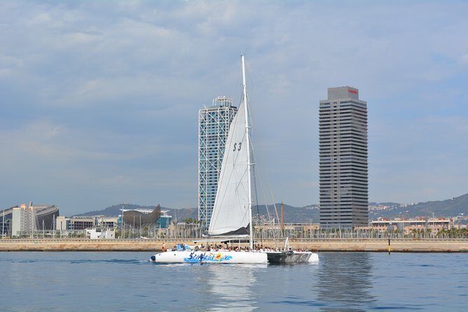 Barcelona Catamaran Party Tour For Young People - The swim stop: tethered rafts, float games, and real Mediterranean time