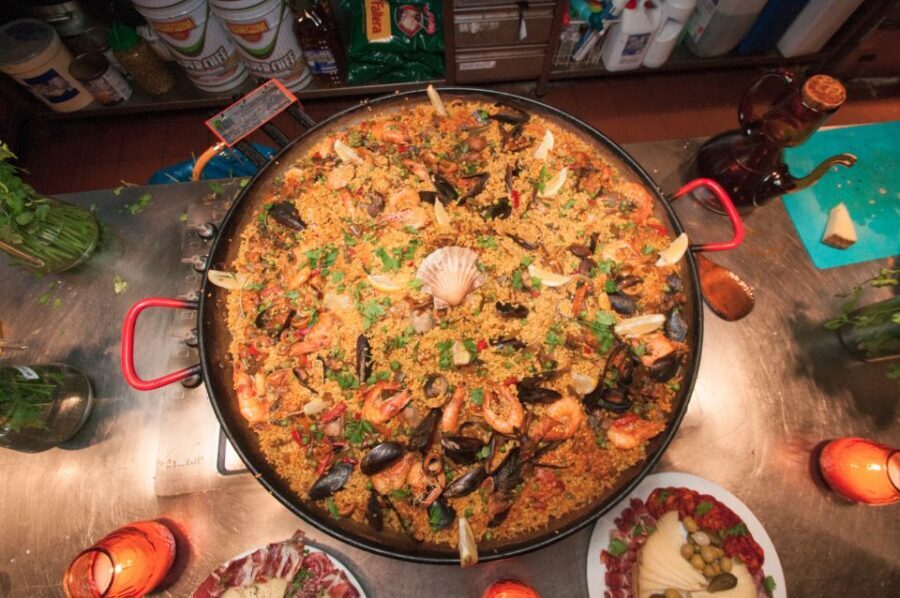 Barcelona: Paella Cooking Experience & Boqueria Market Tour - Entering the Boqueria-to-Paellera Rhythm