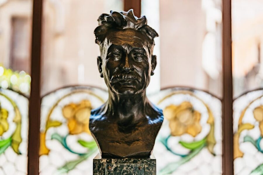 Barcelona: Palau de la Música Guided Tour - Grand staircase floral details and flags you’ll want to photograph