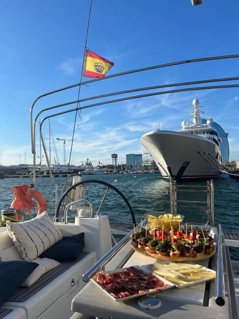 Barcelona: Sailing Tour with Tapas, Drinks and Swim Stop - Getting to Port Vell: Find the boat at Moll de la Barceloneta