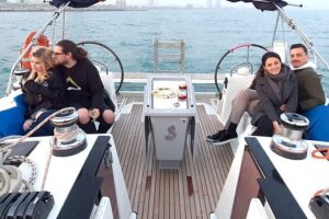 Barcelona Unforgettable Sailing Cruise with Open Bar and Snacks - Hoisting the sails: Barceloneta Beach, W Hotel, and the skyline view