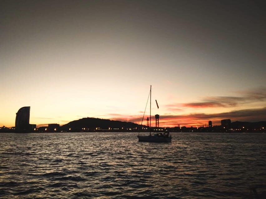 Barcelona: Unique Sunset Sailing Tour with Tapas & Open Bar - From Port Olímpic to Open Water: The First Glow of Twilight