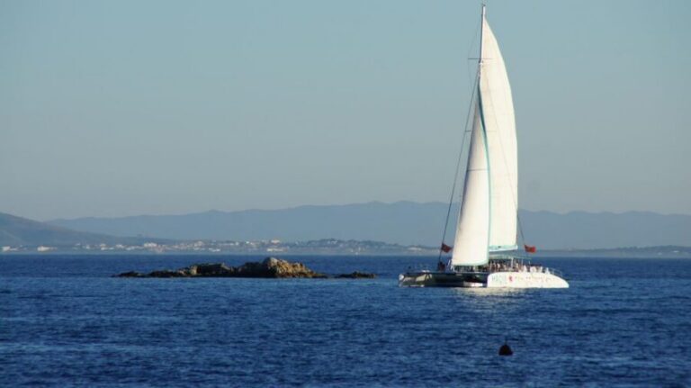 From Roses: Sunset Catamaran Cruise - What Happens on Board: Music, Sangria or Cava, and Slow Moments